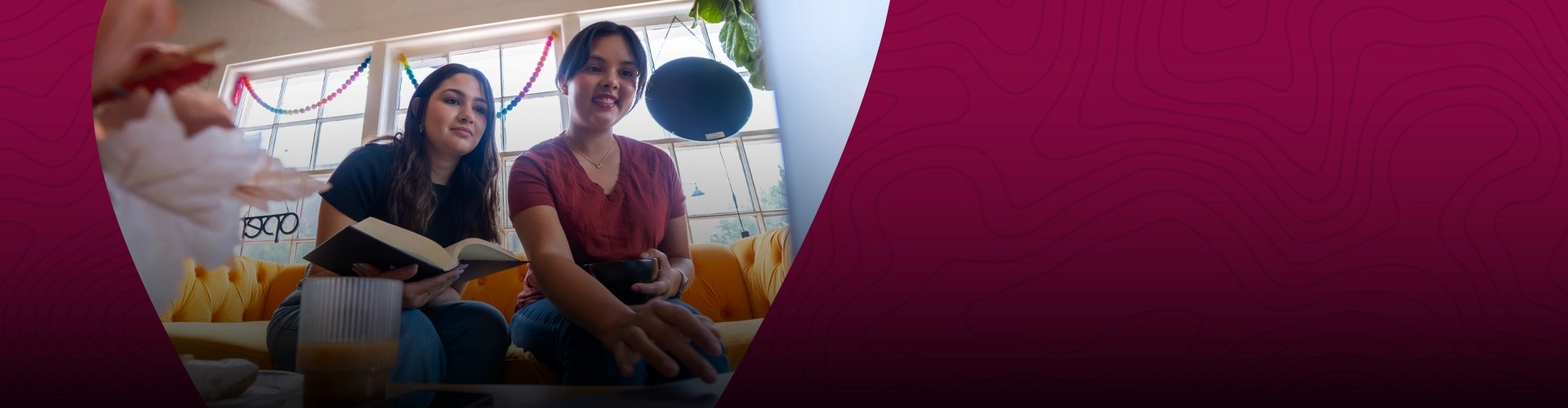 Two young woman explore online degrees at NMSU Global Campus