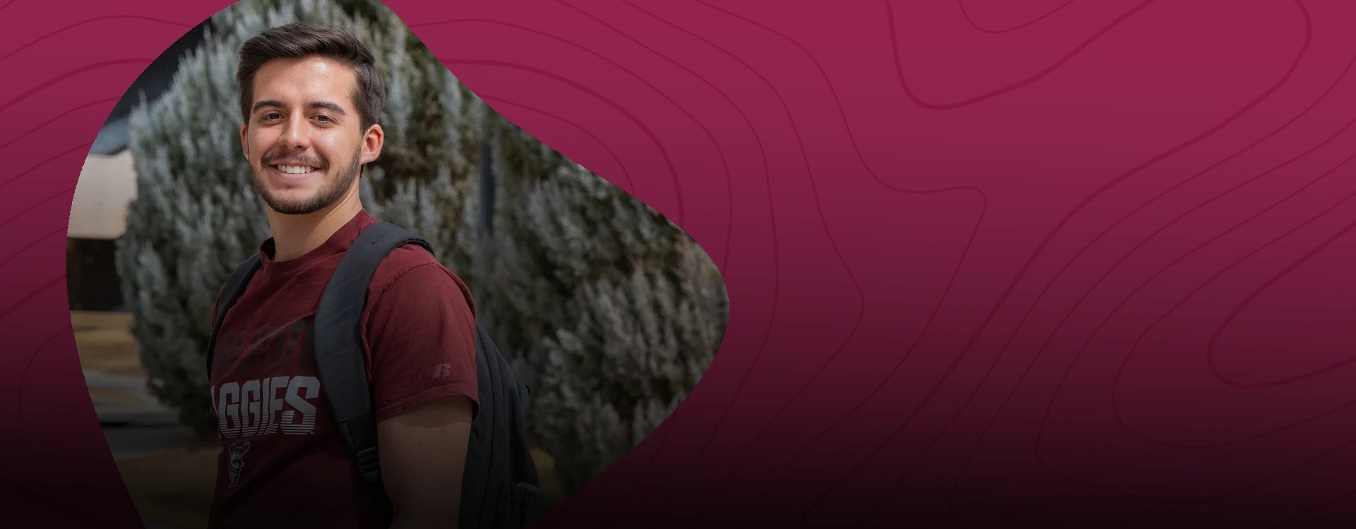 A student at New Mexico State University poses in an Aggies T-shirt — NMSU Global Campus